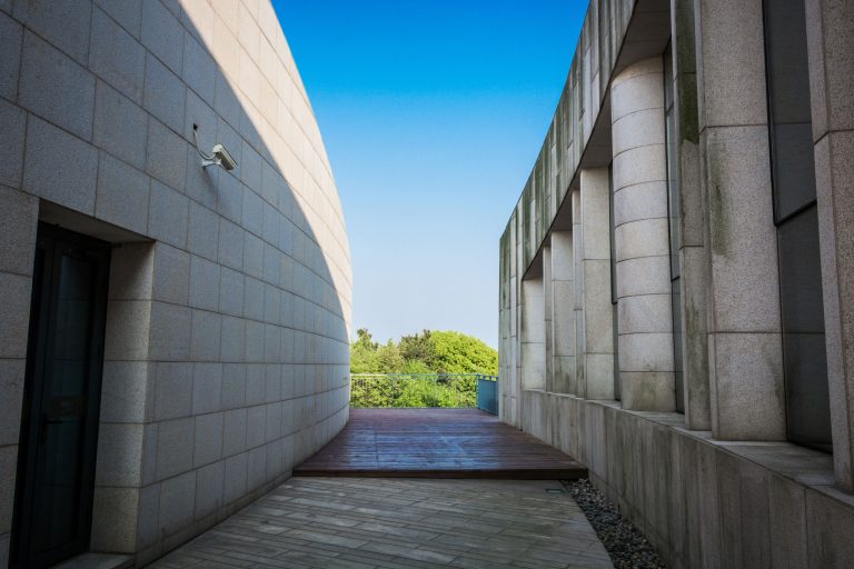 Modern architecture featuring durable materials used to protect concrete projects from weather damage.